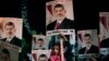 Supporters of Egypt's ousted President Mohammed Morsi hold his posters with Arabic writing which reads " Yes for legality, No for the coup" during a protest outside Rabaah al-Adawiya mosque at Nasr City in Cairo, Aug. 6, 2013.