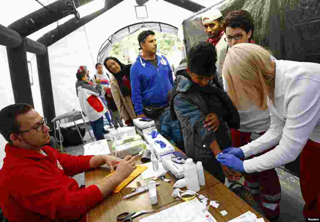 When the flood of Middle Eastern refugees arriving in Europe finally ebbs and asylum-seekers settle down in their new homes, Germany could unexpectedly find itself housing the continent's largest Muslim minority. Newly arrived migrants are given medical attention at an improvised temporary shelter in a sports hall in Hanau.
