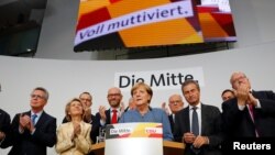 Christian Democratic Union CDU party leader and German Chancellor Angela Merkel reacts on first exit polls in the German general election (Bundestagswahl) in Berlin, Sept. 24, 2017. 