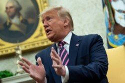 President Donald Trump speaks during a meeting with Paraguay's President Mario Abdo Benitez in the Oval Office of the White House, Dec. 13, 2019, in Washington.