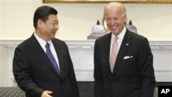 时任中国国家副主席习近平2012年2月14日访问白宫时与美国副总统拜登会晤