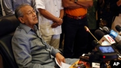 FILE - former Malaysian prime minister Mahathir Mohamad speaks at a press conference in Putrajaya, Malaysia, Feb. 29, 2016. Mahathir has filed a lawsuit against his successor Najib Razak accusing him of corruption.