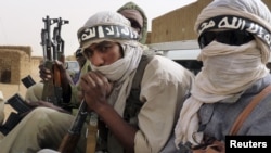 Ansar Dine militiamen traveling in Kidal, northeastern Mali, June 16, 2012.
