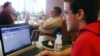 In this April 18, 2013, photo sophomore Mike Ziehr looks at his computer in the student union at the University of Wisconsin-Madison.