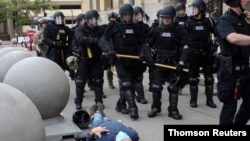 Martin Gugino, a 75-year-old protester, lays on the ground after he was shoved by two Buffalo, New York, police officers during a protest in Niagara Square, June 4, 2020, against the death of George Floyd in Minneapolis police custody.