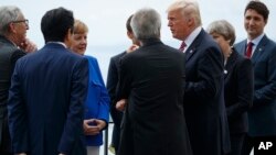 President Donald Trump poses for photos with G-7 leaders at the Ancient Greek Theater of Taormina during the G-7 Summit, May 26, 2017, in Taormina, Italy.