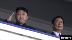 金正恩与中国副主席李源潮2013年6月在朝鲜纪念停战60周年的仪式上