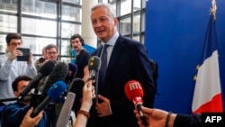 French Economy Minister Bruno Le Maire addresses journalists at his ministry in Paris, July 27, 2019 a day after US President vowed "substantial" retaliation against France for a tax targeting U.S. tech giants.
