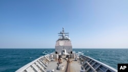 FILE - The Ticonderoga-class guided-missile cruiser USS Chancellorsville (CG 62) transits the Taiwan Strait, Nov. 12, 2019, in this photo made available by U.S. Navy.