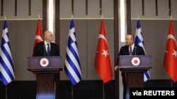 Turkish Foreign Minister Mevlut Cavusoglu and his Greek counterpart Nikos Dendias hold a news conference in Ankara, Turkey, April 15, 2021. (Turkish Foreign Ministry/Handout via Reuters)