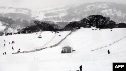 FILE - This picture taken Aug. 1, 2015, shows skiers and snowboarders at Perisher Valley in the Snowy Mountains of southern New South Wales.