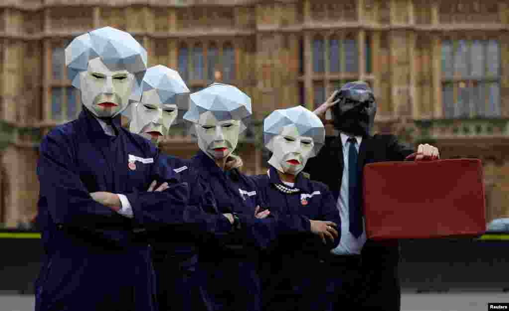 Britain's GMB union stages a protest outside parliament on the day the Finance Minister Philip Hammond presents his budget in London.