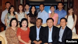 Hun Sen's family includes (back R-L) Hun Sen's daughter-in-law Chay Lin, Hun Sen's son-in-law Dy Vichea and his wife Hun Mana, Hun Sen's son Hun Manet and his wife (unidentified), Hun Sen's son-in-law Sok Puthivuth and his wife Hun Maly and Hun Sen's son Hun Manith and his wife (unidentified). (Front L-R) Somchai's wife Yaowapa Wongsawasdi and Hun Sen's wife Bun Rany. 