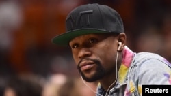 FILE - Boxer Floyd Mayweather Jr. is senn during the first half between the Miami Heat and the Toronto Raptors at American Airlines Arena, Miami, FL, Apr 11, 2018. (Jasen Vinlove-USA TODAY Sports)