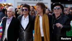 FILE - Members of the Rolling Stones (L-R) Charlie Watts, Ronnie Wood, Mick Jagger and Keith Richards arrive for the "Exhibitionism" opening night gala at the Saatchi Gallery in London, April 4, 2016.