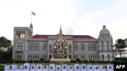 Thailand's Prime Minister Prayuth Chan-ocha, front center, poses with members of the new Thai cabinet at Government House in Bangkok on July 16, 2019. 