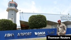 A Saudi security officer walks past the Saudi Arabia's Abha airport after it was attacked by Yemen's Houthi group in Abha, Saudi Arabia, June 13, 2019. 