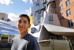 Luke Bastian, a 22-year-old Navajo student from Phoenix, stands for a photograph, May 13, 2021, on the campus of Massachusetts Institute of Technology, in Cambridge, Mass.