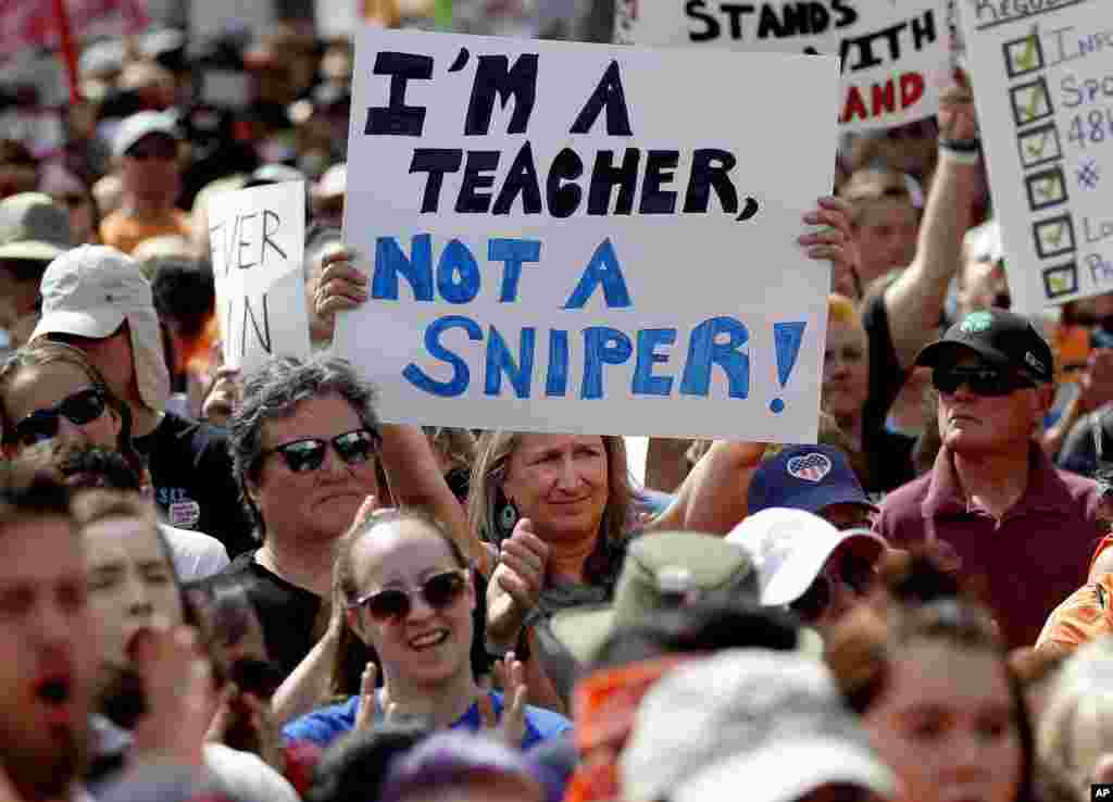 People participate in a "March For Our Lives" rally at the state Capitol, Saturday, March 24, 2018, in Phoenix. (AP Photo/Matt York)