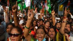 FILE - Supporters of India's main opposition Congress shout slogans during in a nationwide agitation against unemployment, inflation and price hike of essential commodities in Mumbai, Nov. 14, 2021.