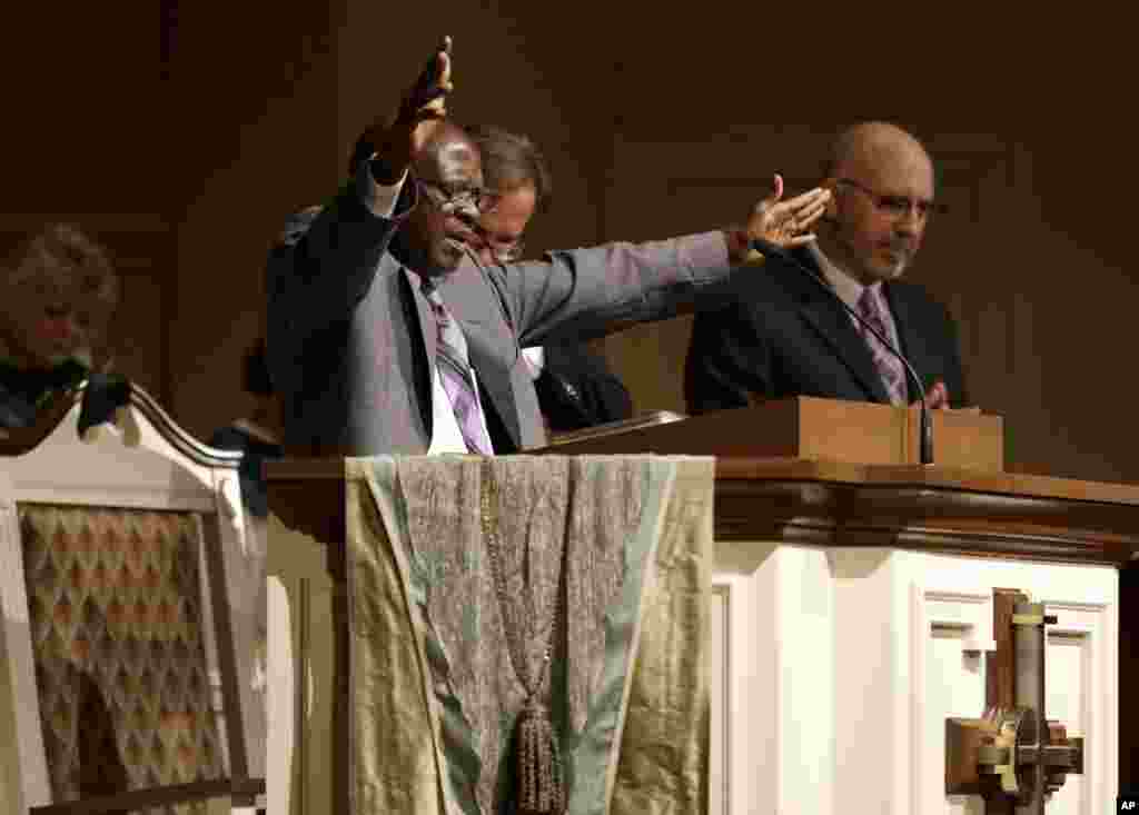 Bishop Nathan Kortu of New Life Fellowship Church preaches to his congregation which he dedicated to Thomas Eric Duncan, who died of Ebola Oct. 8, 2014 at Wilshire Baptist Church in Euless, Texas.