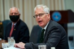 FILE - Acting U.S. Secretary of Defense Christopher Miller speaks during a meeting at the Pentagon, in Arlington, Virginia, Nov. 13, 2020.