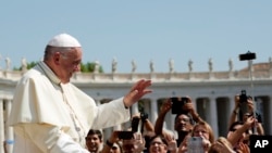 FILE - Pope Francis leaves after his weekly general audience, at the Vatican, Wednesday, Aug. 29, 2018. (AP Photo/Andrew Medichini)