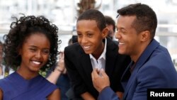Director Yared Zeleke (R), cast members Kidist Siyum (L) and Rediat Amare pose during a photocall for the film "Lamb" in competition for the category "Un Certain Regard" at the 68th Cannes Film Festival in Cannes, southern France, May 20, 2015.
