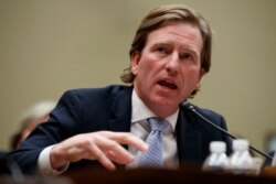FILE - Department of Homeland Security Cybersecurity and Infrastructure Security Agency Director Christopher Krebs testifies on Capitol Hill in Washington, May 22, 2019.