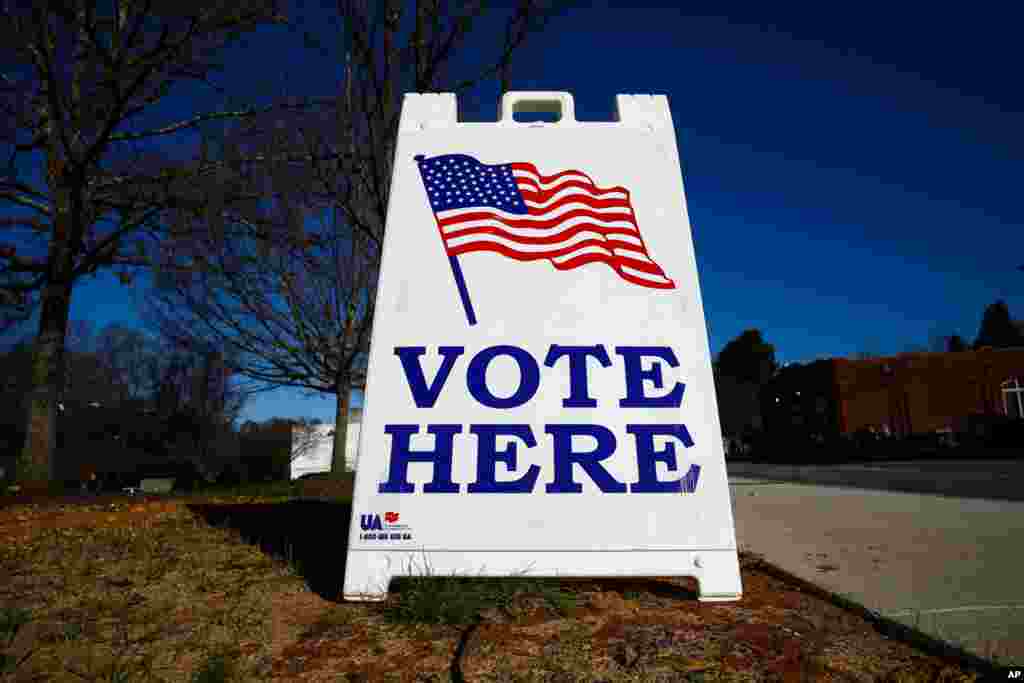 A vote here sign is seen outside a polling place during the South Carolina primary, Feb. 29, 2020, in Columbia, S.C.