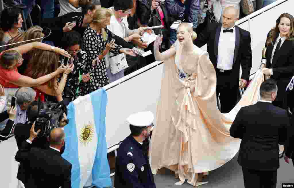 American actress Elle Fanning arrives for the opening ceremony of the 72nd Cannes Film Festival and screening of the film "The Dead Don't Die" in Cannes, France.