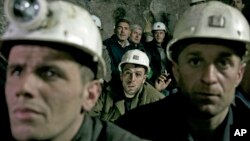 Miners from the Trepca mining complex, sit during a strike, inside the Stari Trg mine, in Kosovo, Jan. 21, 2015. 