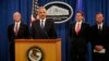 FILE: U.S. officials announced charges against five Chinese military officers at a Washington, D.C., news conference May 19, 2014. Attorney General Eric Holder, second from left, is joined by, from left, David Hickton, John Carlin and Robert Anderson.