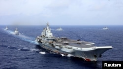 2018年4月18日，中国航母辽宁号参加中国海军在西太平洋的军事演习。