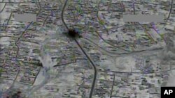An image made from gun-camera video taken on July 4, 2015, and released by U.S. Central Command shows an airstrike on a main road and transit route near Raqqa, Syria. A Turkish news agency published a map Wednesday, showing 10 U.S. locations in northern Syria, prompting Pentagon concerns.