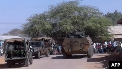 FILE - Kenya Defense Forces soldiers arrive at the scene of a bomb attack claimed by al-Shabab militants in the northeastern town of Mandera, northern Kenya, Oct. 25, 2016.