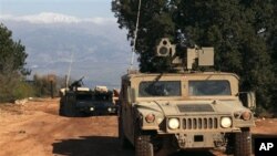 Israeli soldiers on patrol along the Israel-Lebanon border, near Yiftah in the upper Galilee region, 13 Jan 2011