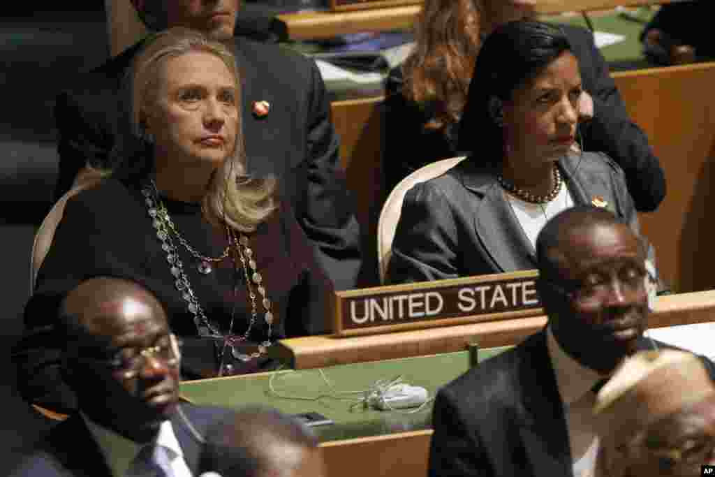 U.S. Secretary of State Hillary Clinton, left, and U.S. Ambassador to United Nations Susan Rice listen as President Barack Obama addresses the 67th session of the United Nations General Assembly, September 25, 2012.