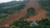 中国贵州省六盘水市水城县鸡场镇坪地村岔沟组2019年7月24日发生山体滑坡，图片中可以看到救援人员和帐篷。
