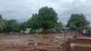 Sejumlah warga memeriksa kerusakan akibat banjir bandang di Flores Timur, Minggu, 4 April 2021. 