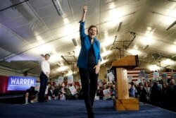 Democratic presidential candidate Sen. Elizabeth Warren, D-Mass., acknowledges supporters at a primary election night rally, Tuesday, Feb. 11, 2020, in Manchester, N.H.