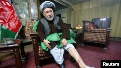 Ahmad Ishchi, who is alleged to have been beaten and detained by officials acting under the authority of Afghanistan's first vice president, Abdul Rashid Dostum, last month, displays an injury on his leg during an interview at his home in Kabul, Afghanistan, Dec. 13, 2016. 