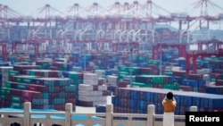 Containers are seen at the Yangshan Deep Water Port in Shanghai, China August 6, 2019. 