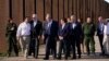 Presiden Joe Biden berbicara dengan anggota parlemen AS, Henry Cuellar (kedua dari kiri), saat mereka berjalan di sepanjang perbatasan AS-Meksiko di El Paso Texas, Minggu, 8 Januari 2023. (AP/Andrew Harnik)