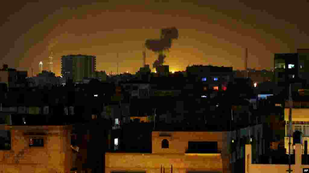 Smoke rises after an Israeli missile strike in Beit Lahia, northern Gaza Strip, July 7, 2014.