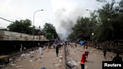Smoke rises as supporters of Imam Mahmoud Dicko and other opposition politicians protest after President Ibrahim Boubacar Keita rejected concessions, aimed at resolving a monthslong political standoff, in Bamako, Mali, July 10, 2020.