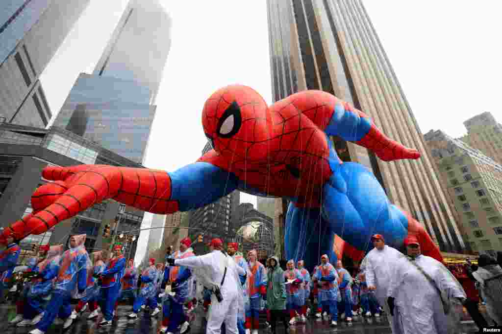 Spider-Man balloon flies during the 98th Macy's Thanksgiving Day Parade in New York City.