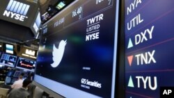 FILE - The Twitter symbol appears above a trading post on the floor of the New York Stock Exchange, July 27, 2016. Twitter’s stock soared following a report Friday that it may be moving closer to selling the business.