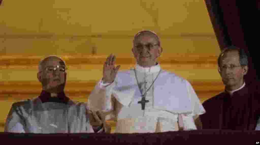 "What I expect him to do most is, for us Africans, he has to support our rights… and he has to join us in the fight against gay and lesbian marriage. We as Africans – we can’t support that." Zaituni Mahmoud, Gudele, Juba Pope Francis waves to the crowd from the central balcony of St. Peter's Basilica, the Vatican, March 13, 2013.