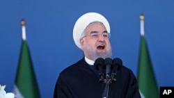Iran's President Hassan Rouhani speaks at a military parade, just outside Tehran, April 17, 2016. The president criticized a new morality police squad in Tehran. (AP Photo/Ebrahim Noroozi)